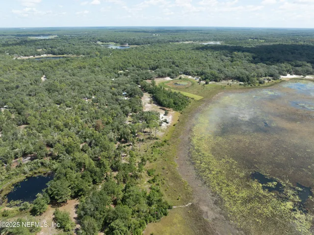 a view of a field with an ocean