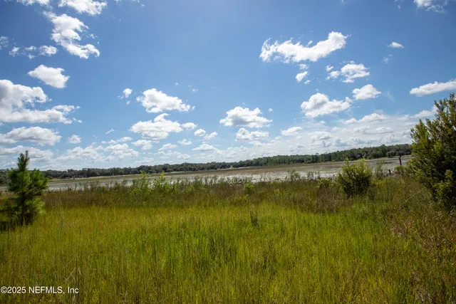 a view of a lake with sunset