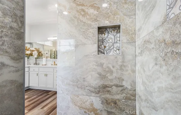 a bathroom with a sink and mirror