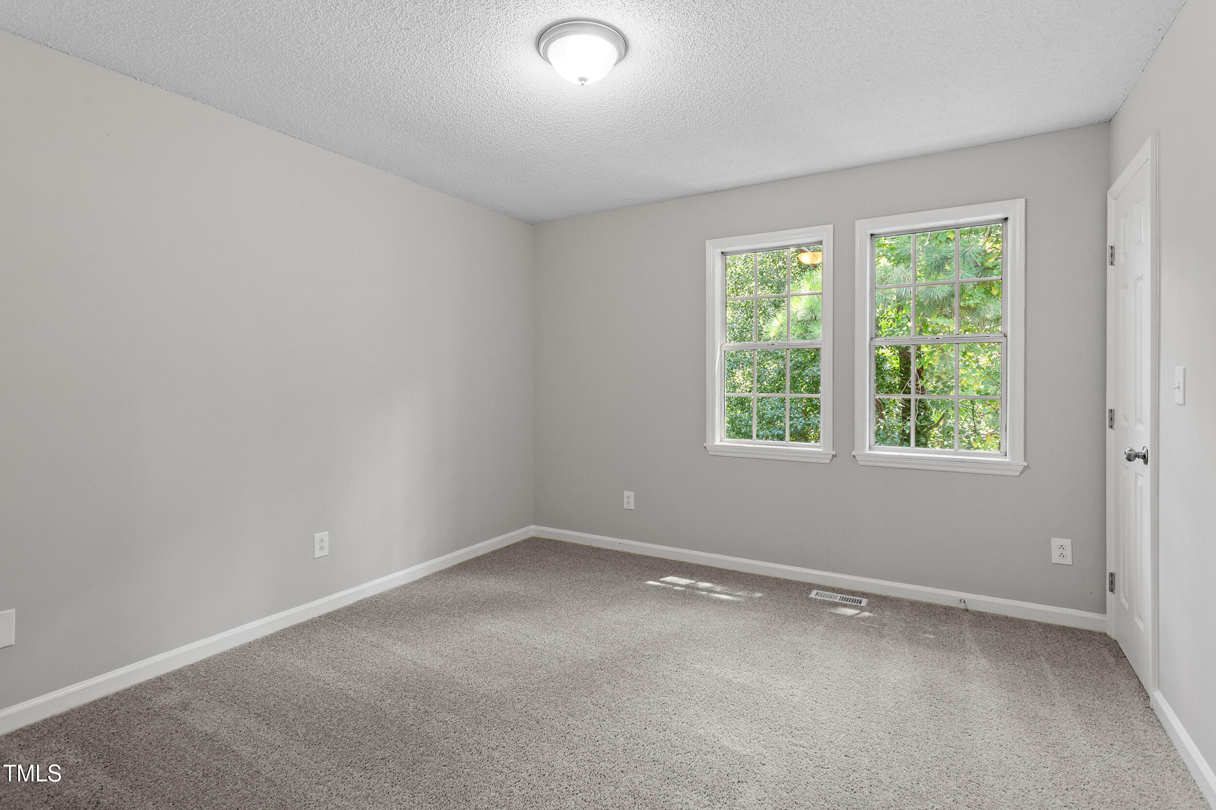 4242 Kaplan Drive Raleigh, NC 27606 - Photo 19 of 30 an empty room with a window
