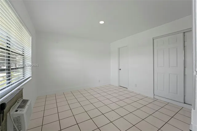 a view of an empty room and window