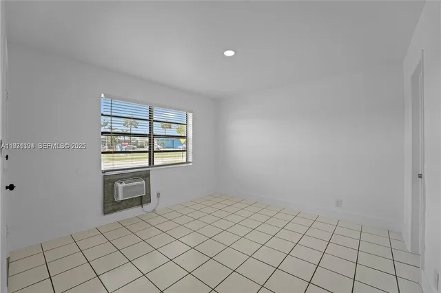 a view of an empty room and window