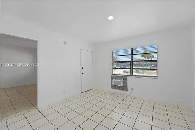 a view of an empty room and window