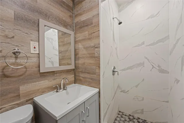 a bathroom with a sink toilet and vanity