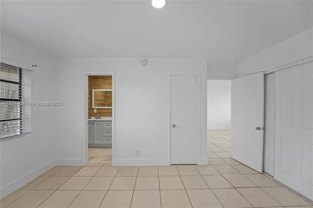 a view of an empty room and window in a room