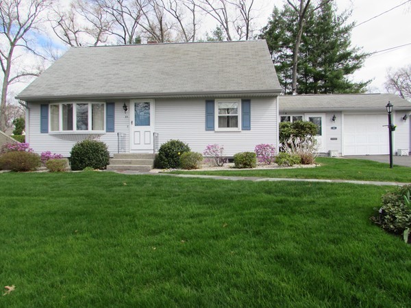 54 Endecott Street Springfield, MA 01118 - Photo 1 of 23 a front view of a house with a garden and yard