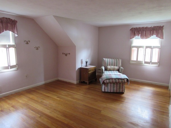 54 Endecott Street Springfield, MA 01118 - Photo 16 of 23 a bedroom with a bed and wooden floor