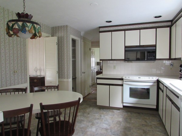 54 Endecott Street Springfield, MA 01118 - Photo 3 of 23 a kitchen with a stove and a microwave