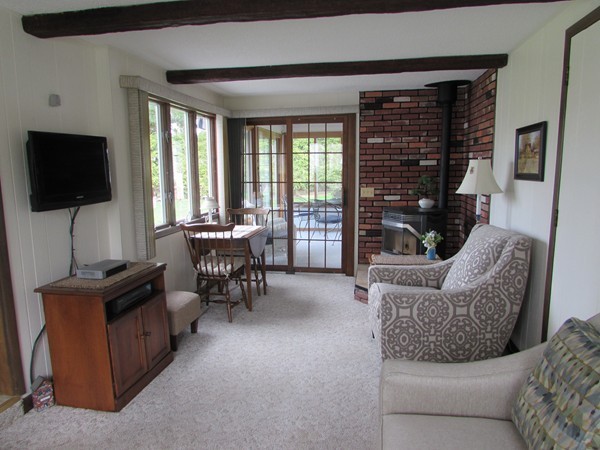 54 Endecott Street Springfield, MA 01118 - Photo 6 of 23 a living room with furniture and a flat screen tv