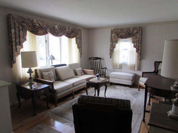 54 Endecott Street Springfield, MA 01118 - Photo 9 of 23 a living room with furniture fireplace and a large window