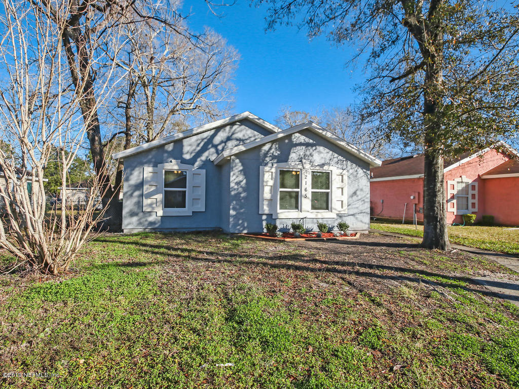 2165 Tuskegee Road Jacksonville, FL 32209 - Photo 2 of 32 a front view of a house with a yard