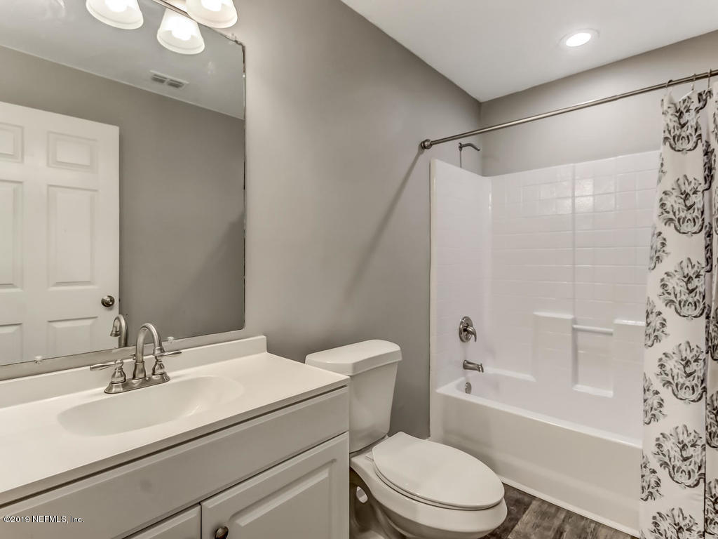 2165 Tuskegee Road Jacksonville, FL 32209 - Photo 26 of 32 a bathroom with a sink toilet and shower