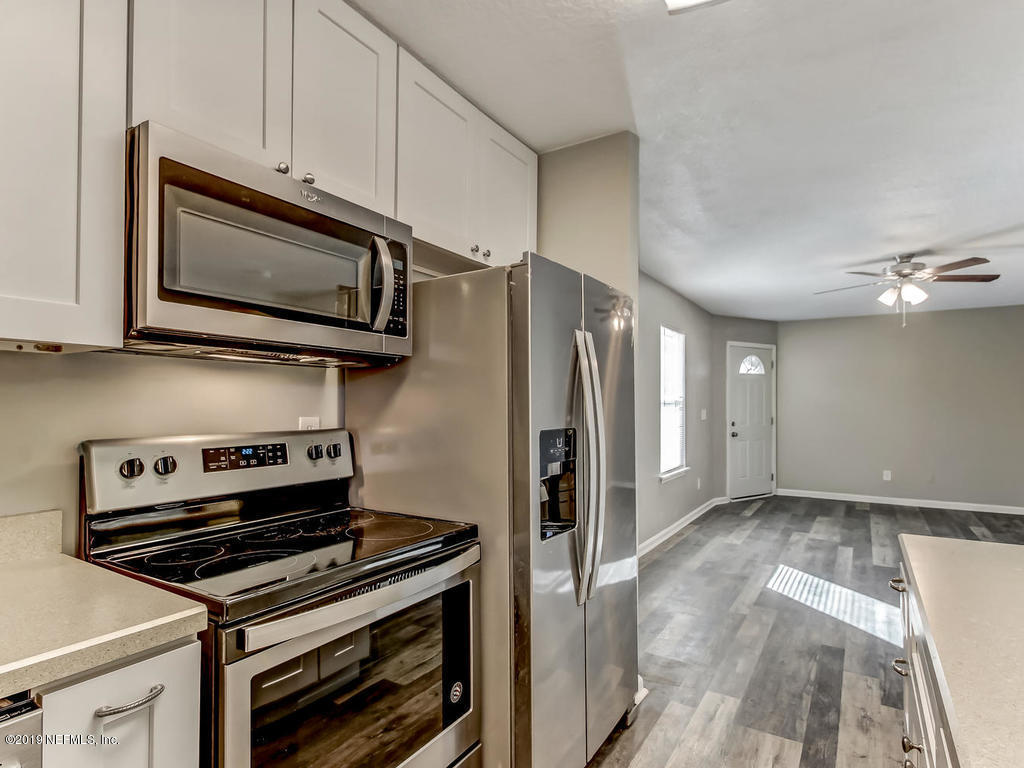 2165 Tuskegee Road Jacksonville, FL 32209 - Photo 10 of 32 a kitchen with appliances and cabinets