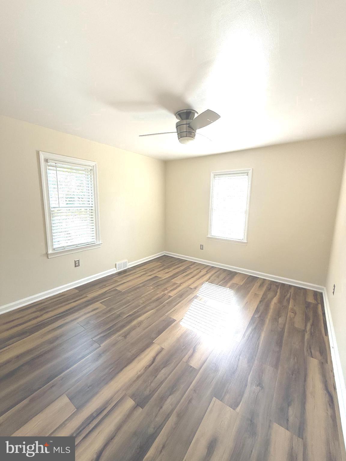 229 Edge Hill Road Glenside, PA 19038 - Photo 11 of 25 an empty room with wooden floor and windows
