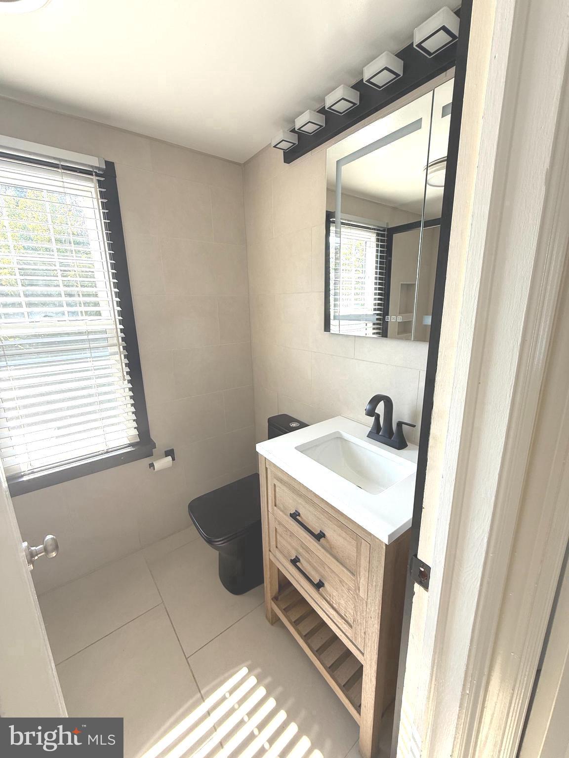 229 Edge Hill Road Glenside, PA 19038 - Photo 13 of 25 a bathroom with a sink and a mirror