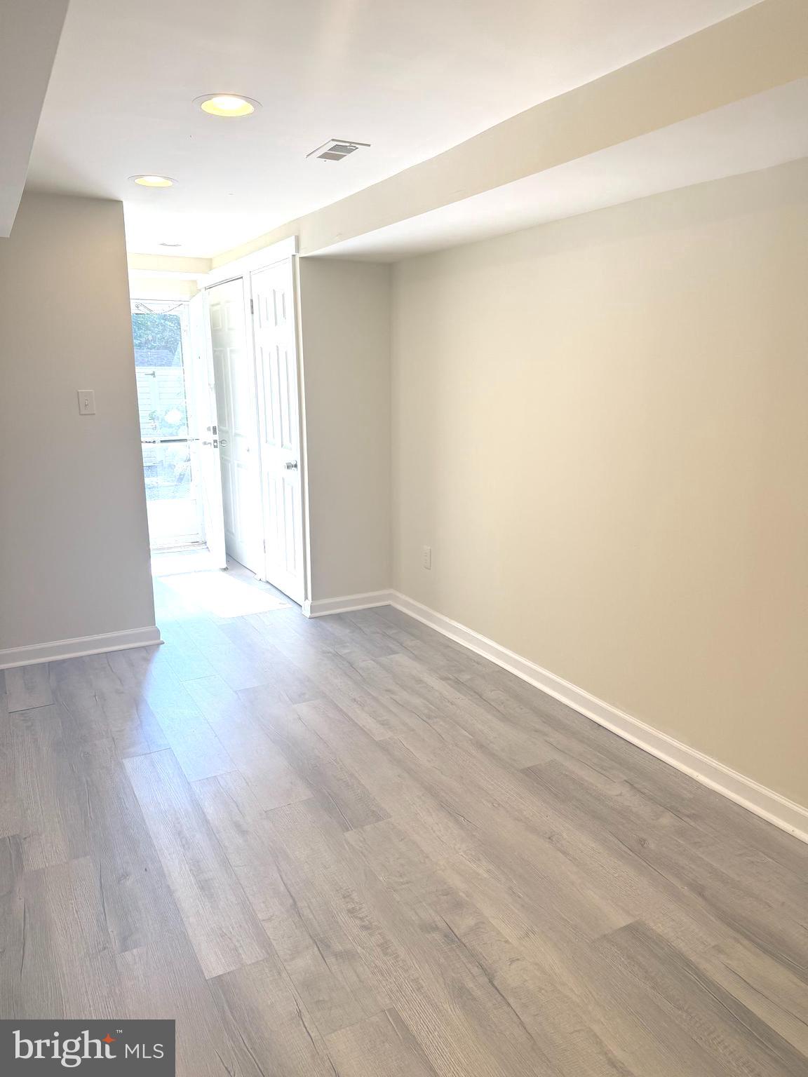 229 Edge Hill Road Glenside, PA 19038 - Photo 21 of 25 a view of an empty room with wooden floor