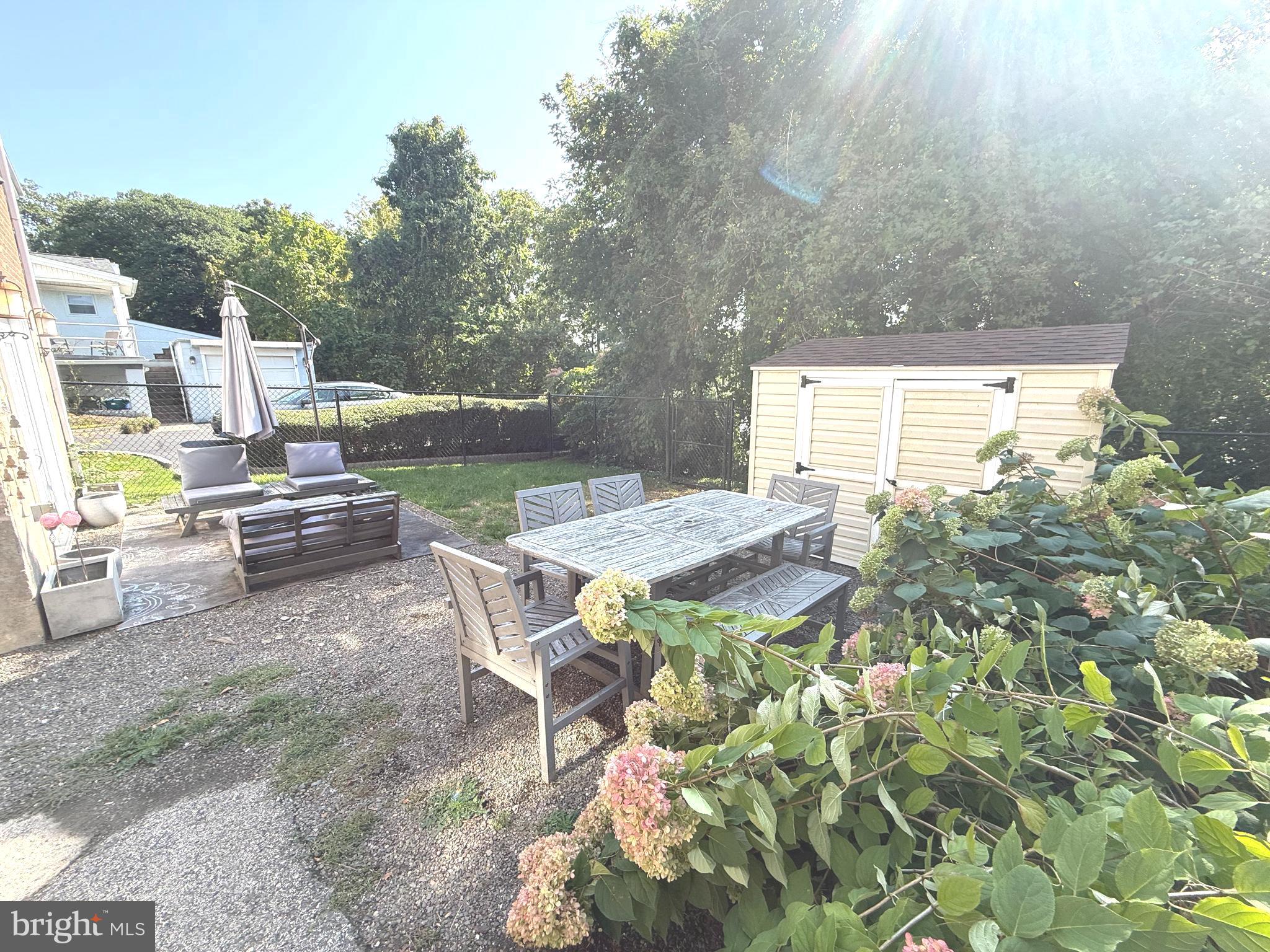 229 Edge Hill Road Glenside, PA 19038 - Photo 25 of 25 a view of backyard with seating area and trees