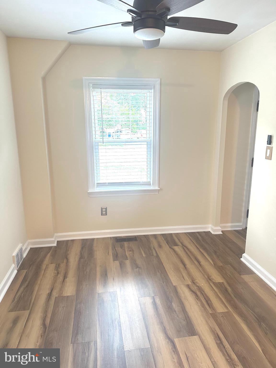 229 Edge Hill Road Glenside, PA 19038 - Photo 6 of 25 an empty room with wooden floor and windows