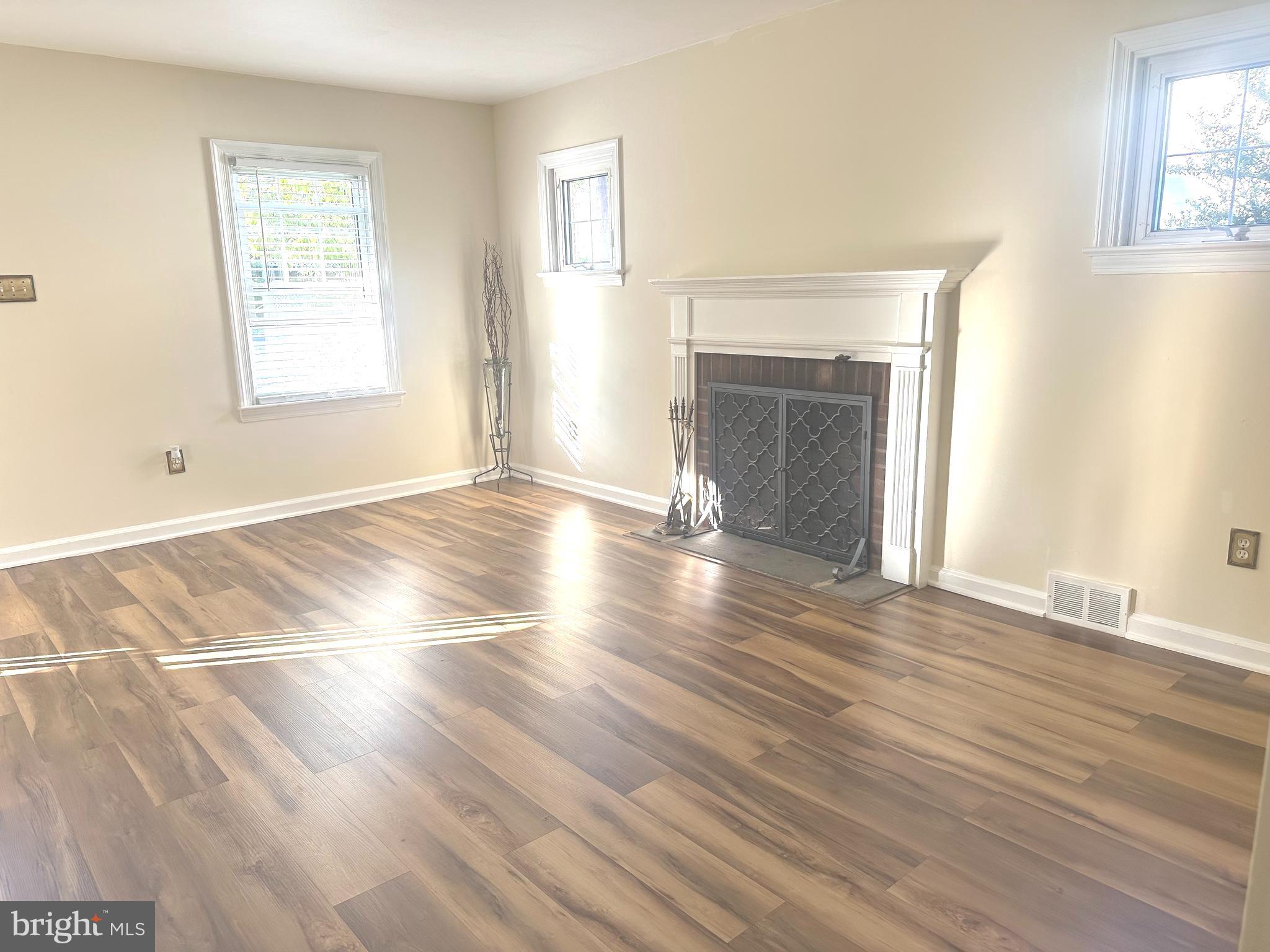 229 Edge Hill Road Glenside, PA 19038 - Photo 7 of 25 a view of an empty room with wooden floor and a window