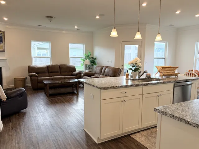 a living room with furniture fireplace and window