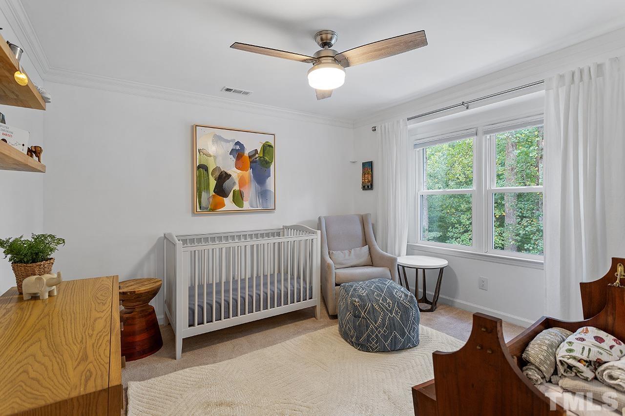 6236 Rushingbrook Drive Raleigh, NC 27612 - Photo 25 of 36 a bedroom with furniture and a large window