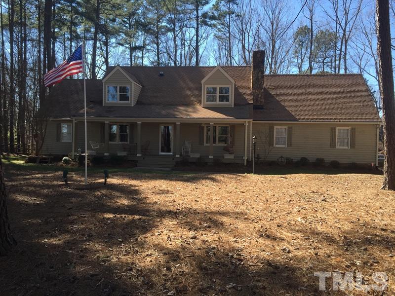 12005 Shooting Club Road Raleigh, NC 27613 - Photo 1 of 25 a view of a white house with a yard