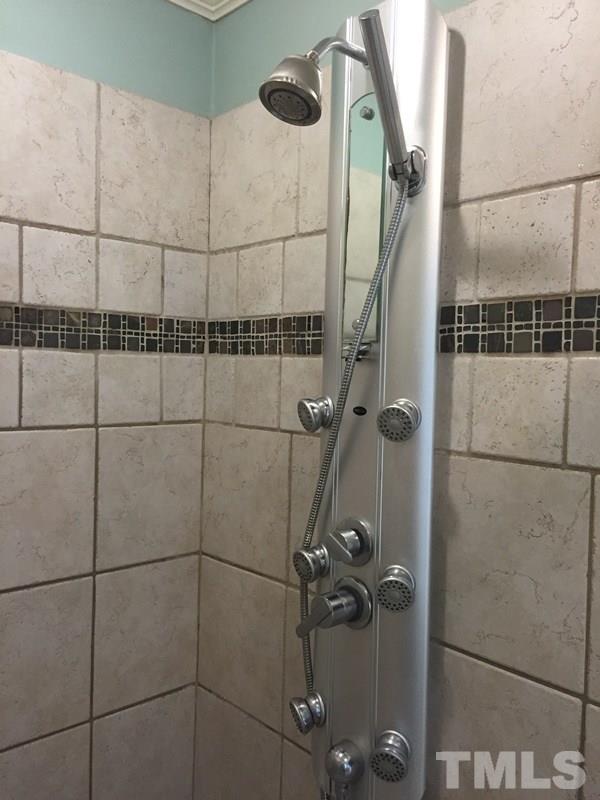 12005 Shooting Club Road Raleigh, NC 27613 - Photo 18 of 25 a bathroom with a shower