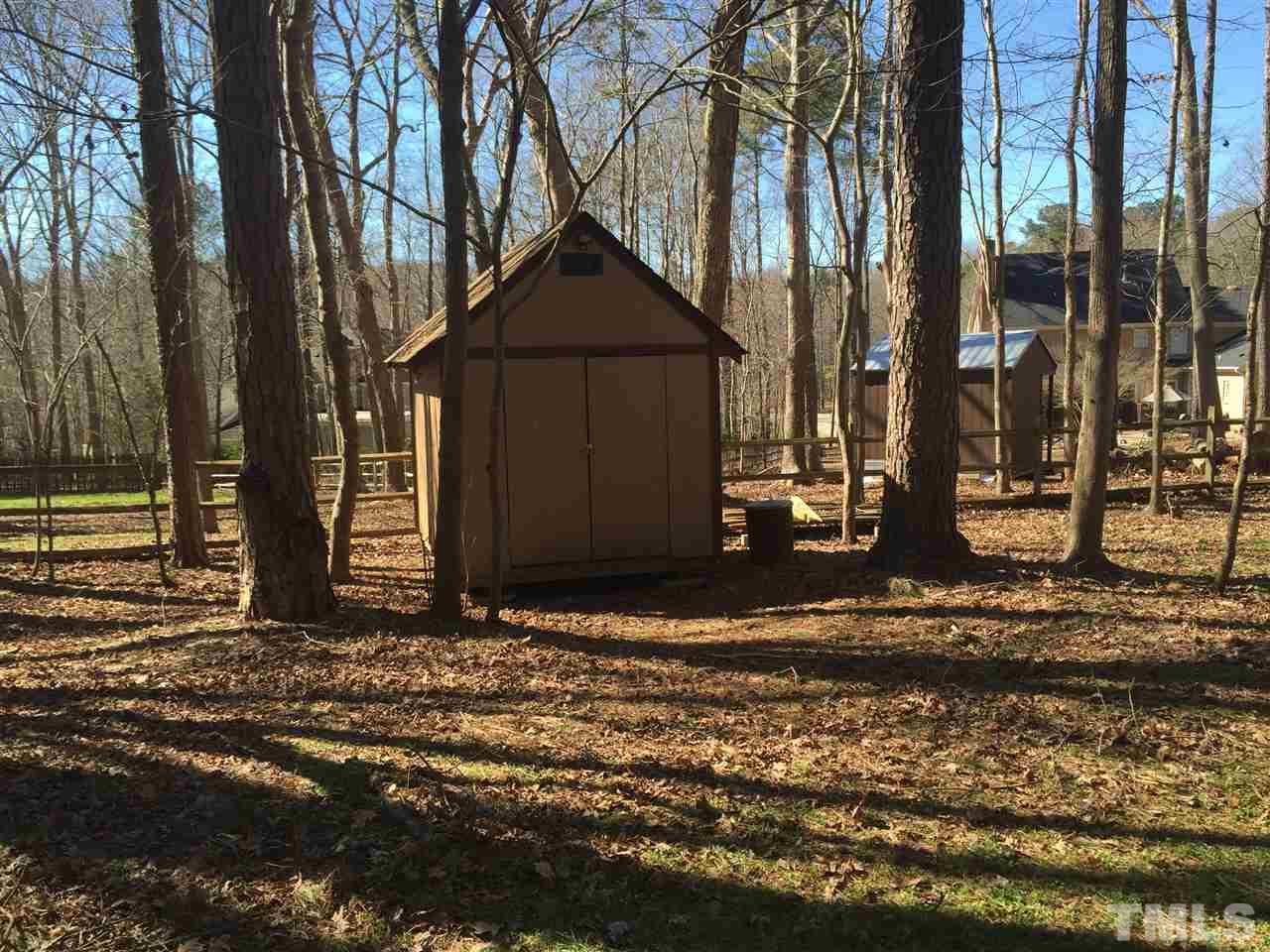 12005 Shooting Club Road Raleigh, NC 27613 - Photo 25 of 25 a view of a house with a yard