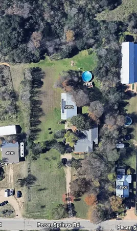 a aerial view of a house with a yard