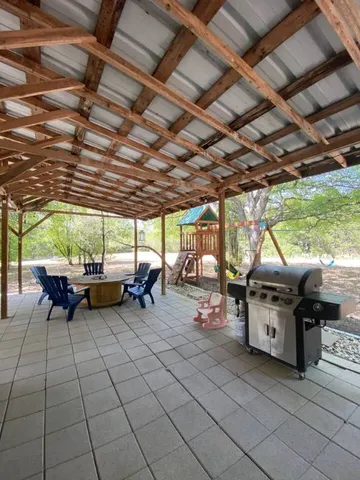a view of a garage with a table and a chair