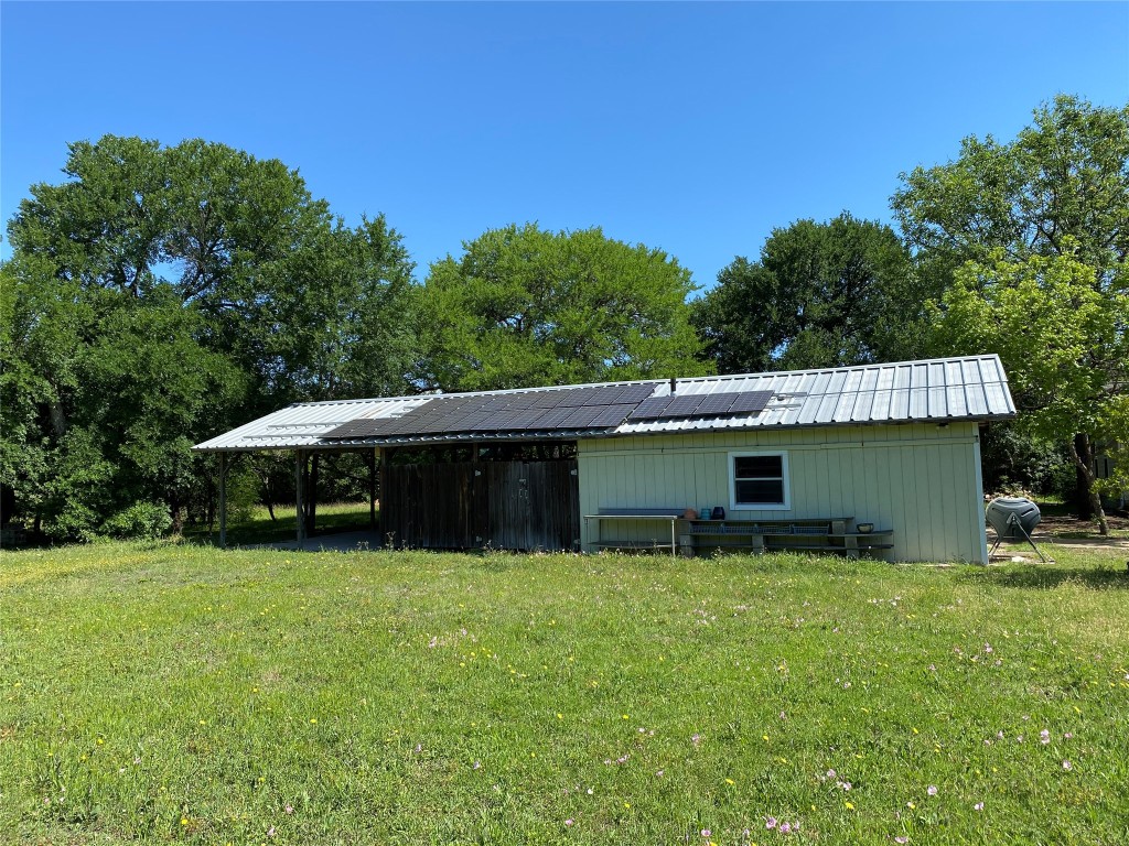 4902 Pecan Springs Road Austin, TX 78723 - Photo 15 of 17 a view of a house with a yard