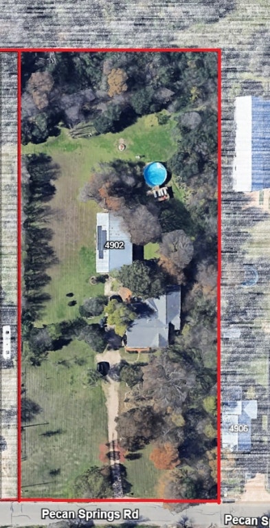 4902 Pecan Springs Road Austin, TX 78723 - Photo 2 of 17 a view of swimming pool with a yard