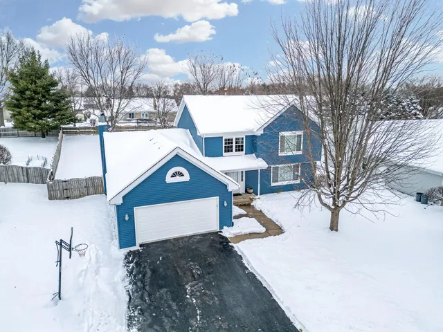 a house with a tree in the background
