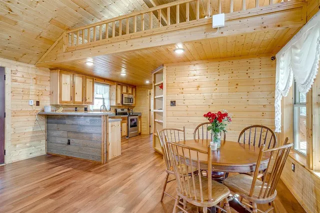 a kitchen with a table and chairs