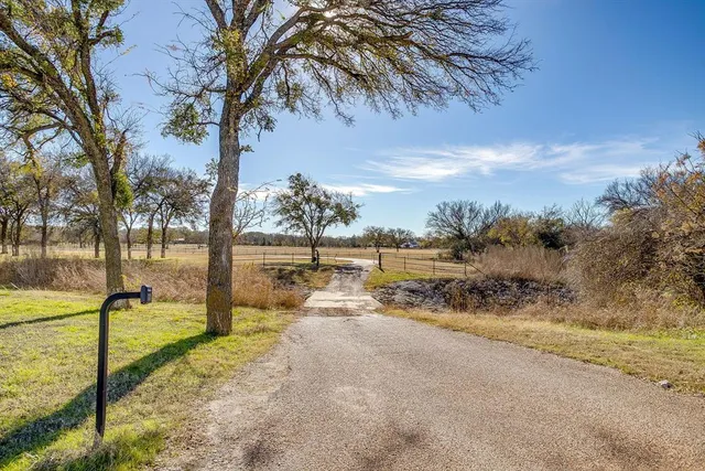 a view of a lake with a yard