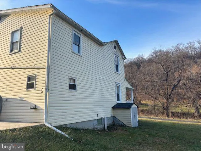 a view of a swimming pool with an outdoor space and seating area