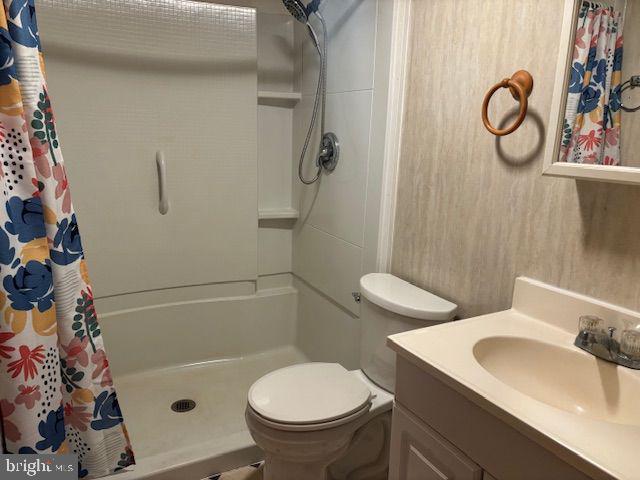16806 Dutch Hollow Road Northwest Mount Savage, MD 21545 - Photo 9 of 17 a bathroom with a sink toilet and shower