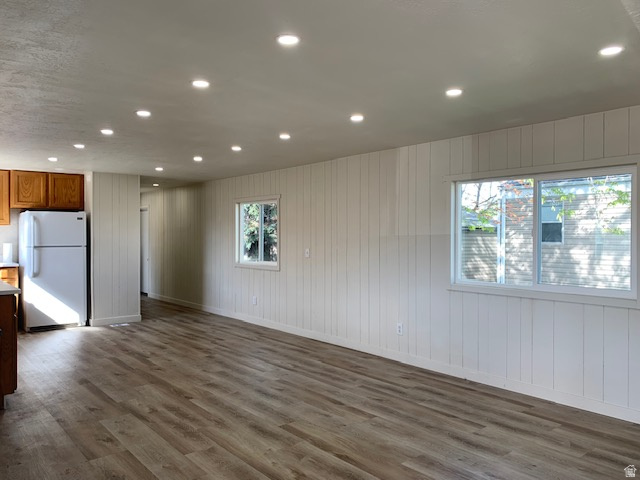 1500 North Angel Street West, Unit 56 Layton, UT 84041 - Photo 5 of 20 Unfurnished room featuring recessed lighting, dark wood-type flooring, and wood walls