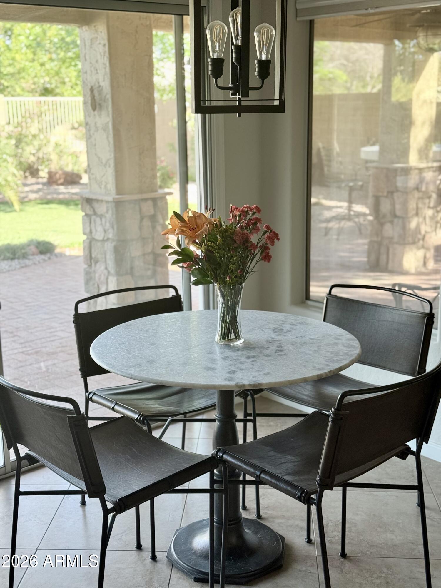 3426 East Clark Road Phoenix, AZ 85050 - Photo 16 of 48 a view of a dining room with furniture and window