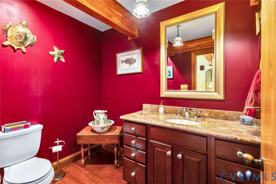 176 Baypointe Court Reedville, VA 22539 - Photo 18 of 60 a bathroom with a toilet a sink and mirror