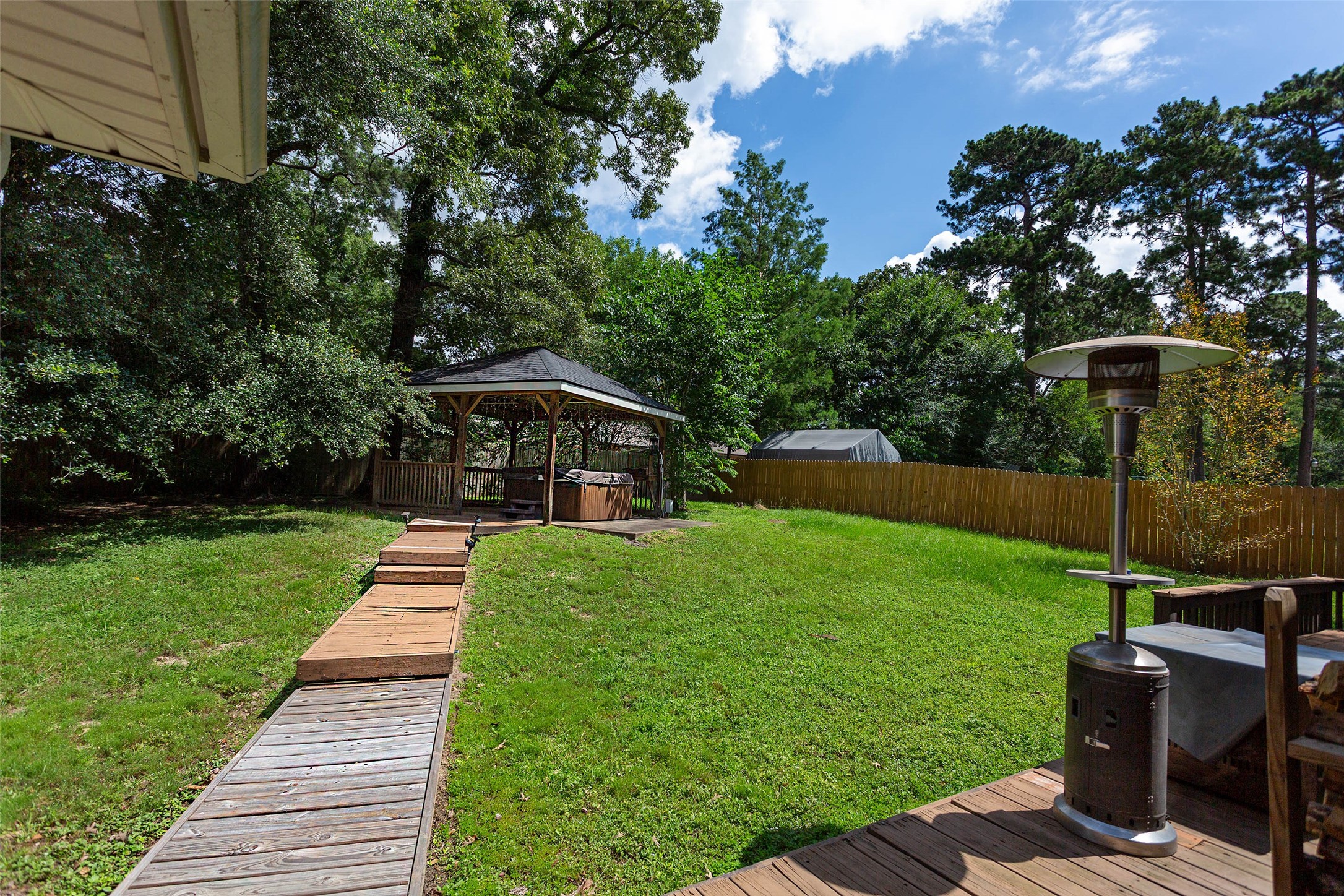 217 Tupelo Lane Conroe, TX 77304 - Photo 20 of 26 Back Yard from Covered Porch