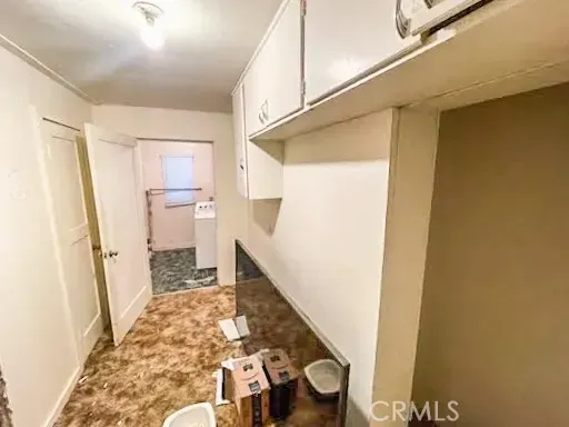 a view of a bathroom with wooden floor and a sink