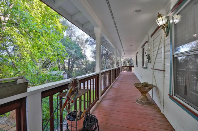 a view of a balcony with wooden floor