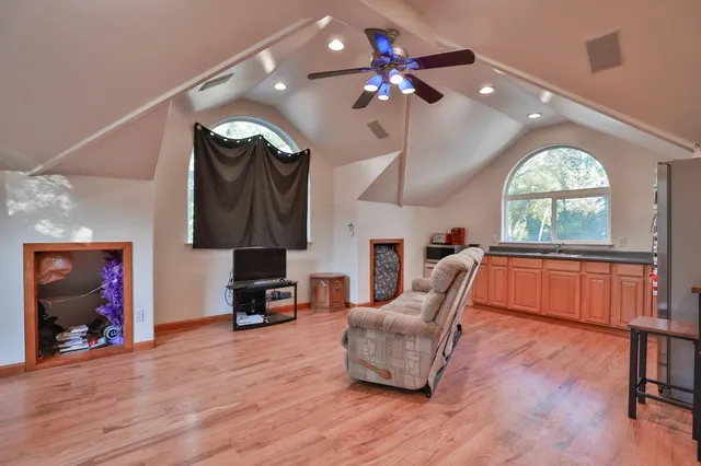 a living room with furniture and a large window