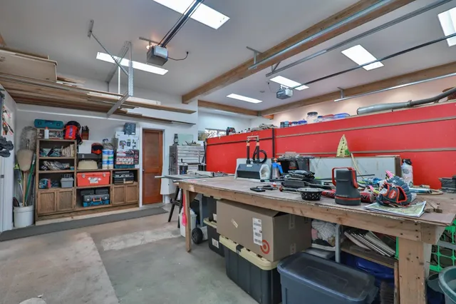 a kitchen with stainless steel appliances kitchen island granite countertop a lot of cabinets