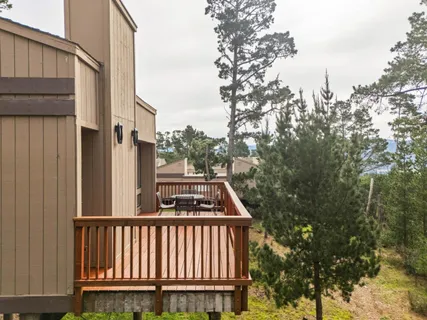a view of a small yard and wooden fence