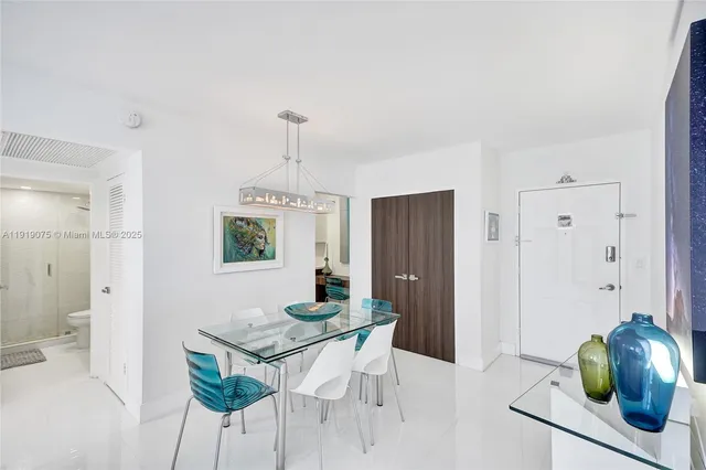 a kitchen with kitchen island a counter top space a sink stainless steel appliances and cabinets