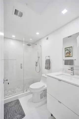 a bed room with two beds and a large window