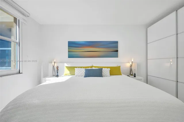 a view of a livingroom with furniture and a flat screen tv