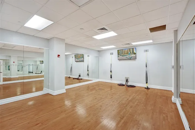 a front view of a building with a yard